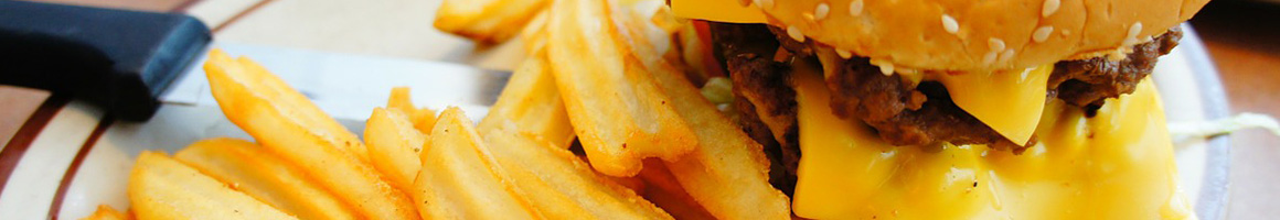 Eating Burger at Chop House Burger restaurant in Dallas, TX.